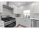 Bright kitchen featuring white cabinets, stainless steel appliances, and updated countertops at 650 Overstreet St, Franklin, IN 46131