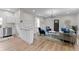 Inviting living room with hardwood floors, modern decor, and an open layout to kitchen at 650 Overstreet St, Franklin, IN 46131