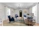 Open living room with modern furniture, hardwood floors, and plenty of natural light at 650 Overstreet St, Franklin, IN 46131