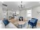 Open-concept living room with modern decor, hardwood floors, and kitchen access at 650 Overstreet St, Franklin, IN 46131
