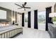 Bedroom featuring neutral walls, a ceiling fan, and multiple windows for great light at 6551 Ambassador Dr, Plainfield, IN 46168