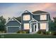 Charming two-story home with a well-manicured lawn and inviting entrance at 6551 Ambassador Dr, Plainfield, IN 46168