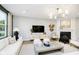 Comfortable living room with a cozy fireplace, modern decor, and ample seating at 6551 Ambassador Dr, Plainfield, IN 46168