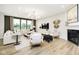 Bright living room with large windows, a fireplace, and plenty of seating at 6551 Ambassador Dr, Plainfield, IN 46168