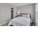 Bedroom featuring two windows, a closet and soft pastel decor at 6683 Halsey St, Zionsville, IN 46077