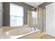 Bathroom featuring a bathtub and a shower at 6916 Havenmoor Pl, Indianapolis, IN 46250