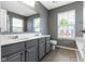 Bathroom featuring double sinks, a vanity, and a toilet at 6916 Havenmoor Pl, Indianapolis, IN 46250