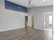 Vaulted ceiling bedroom with hardwood flooring and two doorways at 6916 Havenmoor Pl, Indianapolis, IN 46250