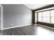 Large bedroom with neutral paint, big window, and light gray vinyl floors at 6916 Havenmoor Pl, Indianapolis, IN 46250