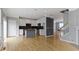Open-concept kitchen featuring white cabinets, an island with granite countertops, and stainless steel appliances at 6916 Havenmoor Pl, Indianapolis, IN 46250