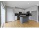 Bright kitchen features white cabinets, granite countertops, a gray island, and stainless steel appliances at 6916 Havenmoor Pl, Indianapolis, IN 46250