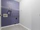 Functional laundry room with ample storage and washer and dryer hookups at 6916 Havenmoor Pl, Indianapolis, IN 46250