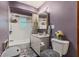 Bathroom features a white sink with a vanity, mirror, patterned shower curtain and a gray and white floor at 6925 W State Road 128, Frankton, IN 46044