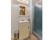 Cozy bathroom featuring a shower with glass door and a vanity with storage at 6925 W State Road 128, Frankton, IN 46044