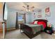 Inviting bedroom with a ceiling fan, a large window, and ample natural light at 6925 W State Road 128, Frankton, IN 46044
