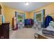 Comfortable bedroom with natural light, a closet with clothing racks, and carpet flooring at 6925 W State Road 128, Frankton, IN 46044