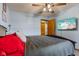 Serene bedroom featuring a ceiling fan, comfortable bedding, and stylish decor for a relaxing retreat at 6925 W State Road 128, Frankton, IN 46044
