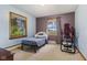 Cozy bedroom with two windows, light blue and purple walls, and dark wood trim around the windows at 6925 W State Road 128, Frankton, IN 46044