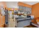 Kitchen with gray cabinetry and a breakfast bar that has black countertops at 6925 W State Road 128, Frankton, IN 46044
