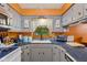 Charming kitchen featuring a sink with a garden view, upper and lower cabinets, and modern appliances at 6925 W State Road 128, Frankton, IN 46044