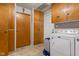 Efficient laundry area with washer, dryer, abundant cabinet space, and practical layout at 6925 W State Road 128, Frankton, IN 46044