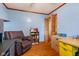 Office featuring hardwood floors, a comfortable chair, filing cabinet and a small bookshelf filled with books at 6925 W State Road 128, Frankton, IN 46044