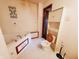 Bathroom boasts a corner jetted tub with tile details and a wall-mounted cabinet at 704 E Perry St, Indianapolis, IN 46227