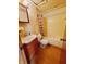 Cozy bathroom featuring a tub, toilet, sink with vanity, and medicine cabinet at 704 E Perry St, Indianapolis, IN 46227