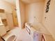 Bathroom featuring a jetted tub with tile accents and a glass-enclosed shower at 704 E Perry St, Indianapolis, IN 46227