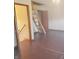 Bright bedroom offers a rustic wooden ladder to an upper space and neutral walls at 704 E Perry St, Indianapolis, IN 46227