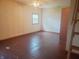 Bedroom with a window, a ceiling fan, and a rustic wooden ladder leading to an upper space at 704 E Perry St, Indianapolis, IN 46227