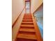 A wooden staircase with a handrail leads to the upper floors of the house at 704 E Perry St, Indianapolis, IN 46227