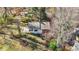 Scenic aerial view of home nestled in a wooded area, surrounded by trees at 7335 Bethany Park, Martinsville, IN 46151