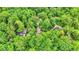 An aerial view of the house surrounded by lush greenery in a residential area at 7335 Bethany Park, Martinsville, IN 46151