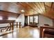 Finished attic area with hardwood flooring, wood paneled ceiling, and staircase at 7335 Bethany Park, Martinsville, IN 46151