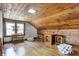 Cozy attic with wood paneled walls, hardwood floors, and natural lighting at 7335 Bethany Park, Martinsville, IN 46151