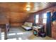 Cozy attic space with wood paneled walls, a futon, and natural light at 7335 Bethany Park, Martinsville, IN 46151