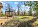 A spacious backyard with a large deck, outdoor swing, and well-maintained lawn at 7335 Bethany Park, Martinsville, IN 46151