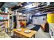 Unfinished basement featuring exposed pipes, brick walls and shelves at 7335 Bethany Park, Martinsville, IN 46151