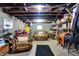 Finished basement area with exposed ceiling and brick accents, furnished with seating and storage at 7335 Bethany Park, Martinsville, IN 46151