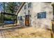 View of home's back entrance with a beautiful wooden deck and relaxing outdoor swing at 7335 Bethany Park, Martinsville, IN 46151