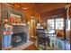 Charming dining area with a brick fireplace and a wooden dining table at 7335 Bethany Park, Martinsville, IN 46151