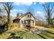 Charming cottage-style home featuring a spacious deck and a cozy swing, surrounded by lush greenery at 7335 Bethany Park, Martinsville, IN 46151