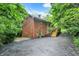 Charming multi-story home with brick and wood siding, a wooden staircase, and lovely landscaping at 7335 Bethany Park, Martinsville, IN 46151