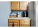 Well-organized kitchen corner with wooden cabinets, countertop appliances, and ample storage at 7335 Bethany Park, Martinsville, IN 46151