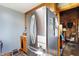 Spacious kitchen boasts a stainless steel refrigerator and a glimpse into a cozy, wood-paneled room at 7335 Bethany Park, Martinsville, IN 46151