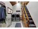 Well-lit laundry room with stainless steel washer and dryer and convenient storage options at 7335 Bethany Park, Martinsville, IN 46151