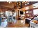 Inviting living room with wooden walls and floors, comfortable seating, and natural light at 7335 Bethany Park, Martinsville, IN 46151