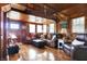 Comfortable living room showcasing wood walls, hardwood floors, natural light, and cozy seating at 7335 Bethany Park, Martinsville, IN 46151