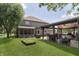 Enjoy outdoor living with a backyard featuring a patio, grill area, and lush green space at 7430 Franklin Parke Woods, Indianapolis, IN 46259